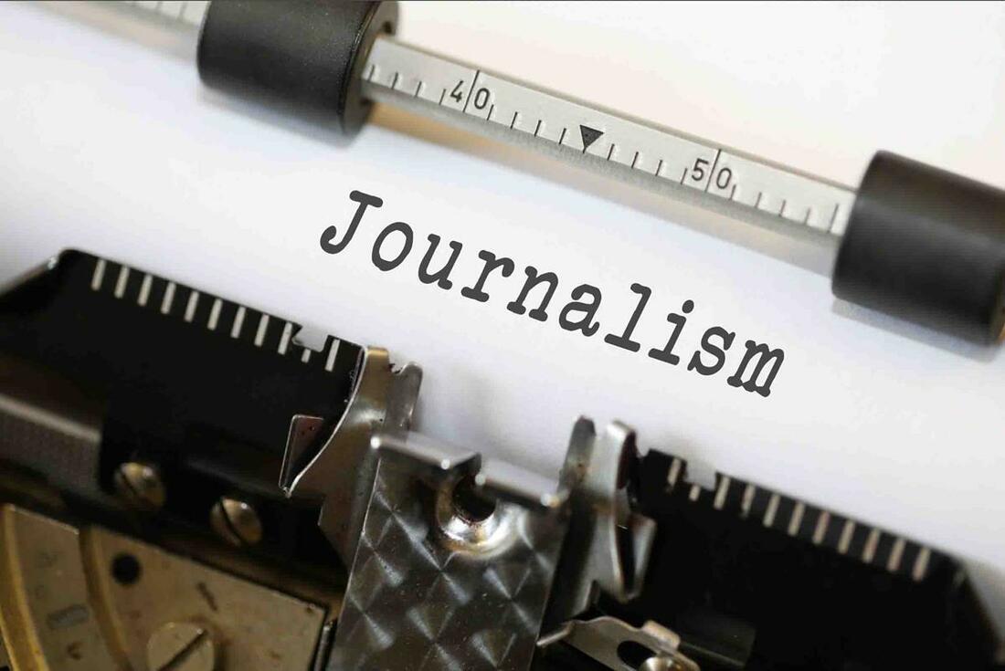 Close-up of a typewriter with the word “Journalism” typed on the page.